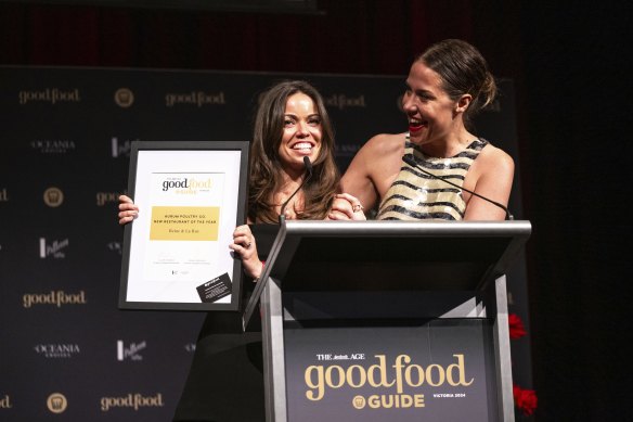 Restaurateur Rebecca Yazbek (left) and chef Jacqui Challinor accept the Aurum Poultry Co. New Restaurant of the Year award for Reine &amp; La Rue.