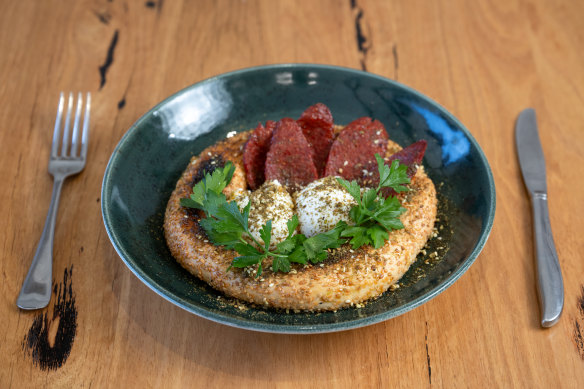 Eggs with kolouri and sujuk, a style of beef sausage.