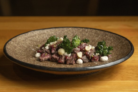 Kangaroo tartare is a texturally interesting combination of raw roo, macadamias, preserved lemon and kale.