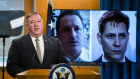 US Secretary of State Mike Pompeo in front of a video monitor with images of Michael Spavor, left, and Michael Kovrig.