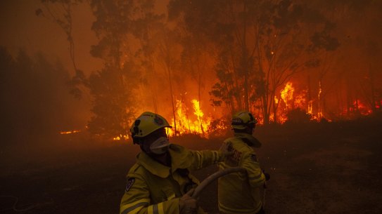 Local firefighters battle a fire at Mangrove Mountain in NSW on Sunday, January 5, 2020. Australia has also called in overseas firefighters and experts to battle the mammoth blazes here.