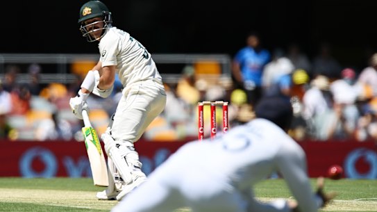 David Warner watches on as Rohit Sharma shapes for the catch in Brisbane.