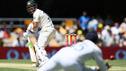 David Warner watches on as Rohit Sharma shapes for the catch in Brisbane.