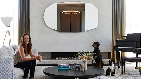 “The kids all play instruments and Jeff plays the guitar, so this has become the family music room,” says Janine. The sofa is from Hub and the mirror from Space Furniture.