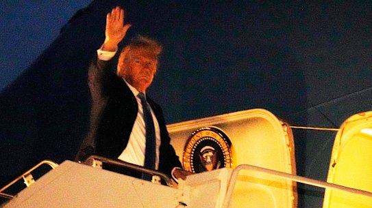 President Donald Trump boards Air Force One at Calgary International Airport.