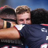 Filipo Daugunu of the Rebels celebrates with teammates.
