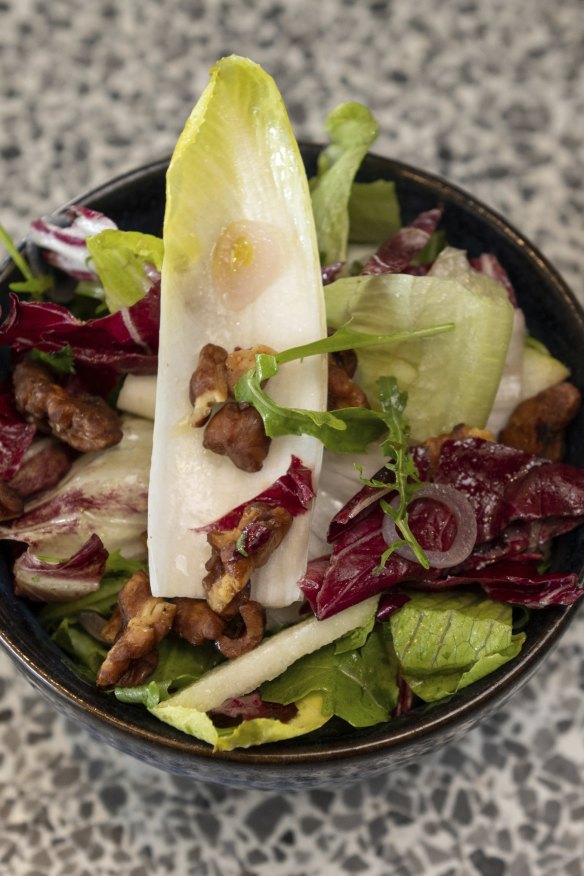 Leaf salad with pear, walnuts and pickled shallots.