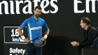 Novak Djokovic speaks with new coach Andy Murray during the first round of the Australian Open.