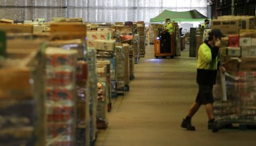 The man worked at a Woolworths distribution centre - similar to this one in Brisbane - while telling WorkCover he had not worked due to his back injury and depression.