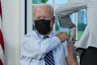 US President Joe Biden receives a COVID-19 booster shot at the White House.
