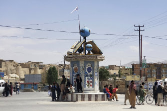 A Taliban flag flies in a town square in Ghazni Thursday.