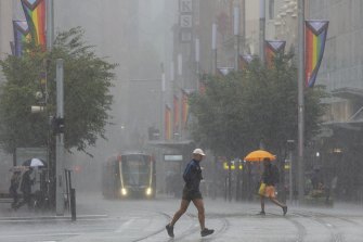 La Nina strikes again as rain hammers George Street in Sydney’s CBD.