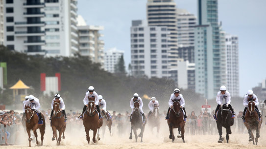 Horses gallop on Surfers Paradise Beach prior to the 2020 Magic Millions barrier draw. 