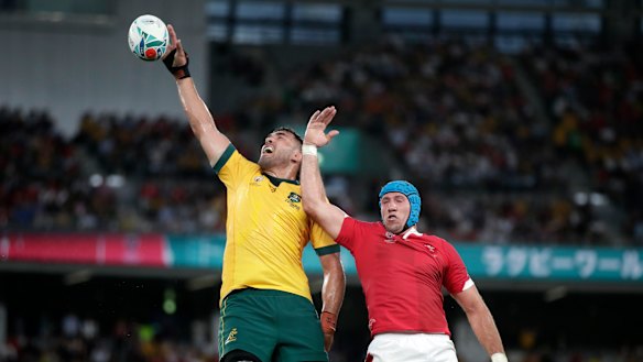 Australia's Rory Arnold, left, leaps above Wales' Justin Tipuric to win a lineout at last year's Rugby World Cup. 