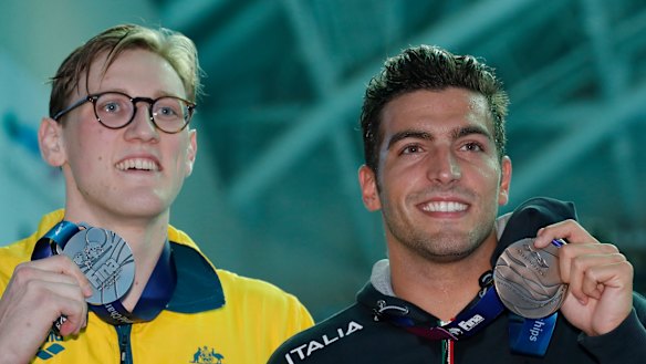Australia's Mack Horton, left, holds his silver medal with bronze medallist Italy's Gabriele Detti after refusing to stand on the podium with the gold medal winner China's Sun Yang.