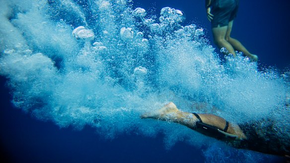 Walter Denton dives into the ocean in Agat: "Being out there, on the water, it's comforting. I just look around. It takes me to a different place."