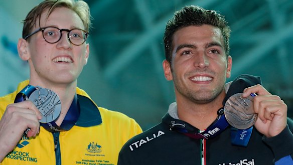 Australia's Mack Horton, left, holds his silver medal with bronze medallist Italy's Gabriele Detti after refusing to stand on the podium with the gold medal winner China's Sun Yang