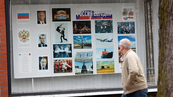 A man walks past the Russian embassy in Prague, Czech Republic. The country is expelling three staffers from the embassy.