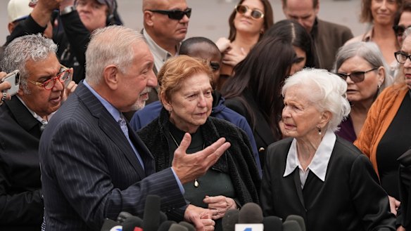 The aunts of Lyle and Erik Menendez, Teresita Baralt (centre) and Joan Andersen VanderMolen (right) with lawyer Mark Geragos, after Monday’s court hearing in Los Angeles.
