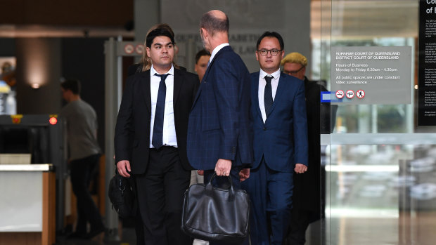 Brisbane Auto Recycling directors Asadullah Hussaini (right) and Mohammad Ali Jan Karimi (left) leave the District Court in Brisbane on Thursday.