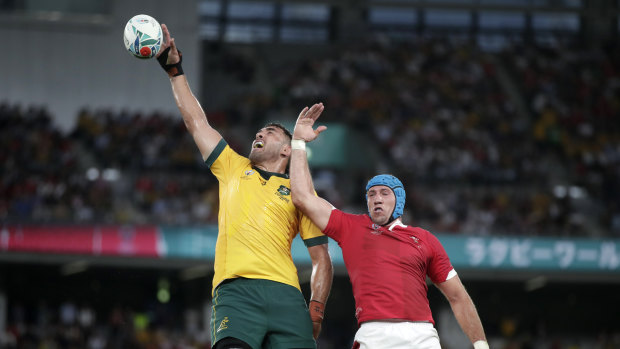 Australia's Rory Arnold, left, leaps above Wales' Justin Tipuric to win a lineout at last year's Rugby World Cup. 
