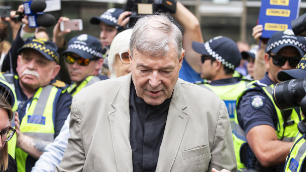 Cardinal George Pell leaves Melbourne's County Court after his guilty verdict was made public.