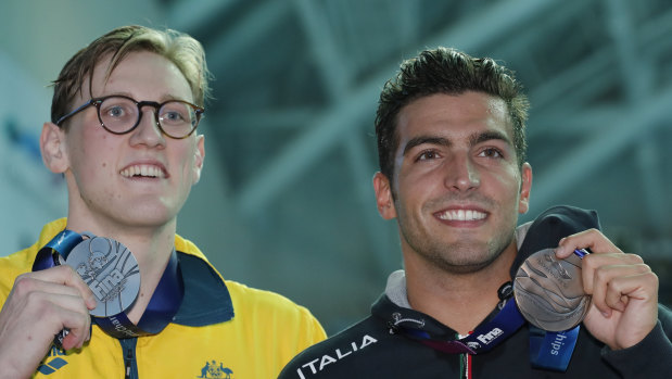 Australia's Mack Horton, left, holds his silver medal with bronze medallist Italy's Gabriele Detti after refusing to stand on the podium with the gold medal winner China's Sun Yang.