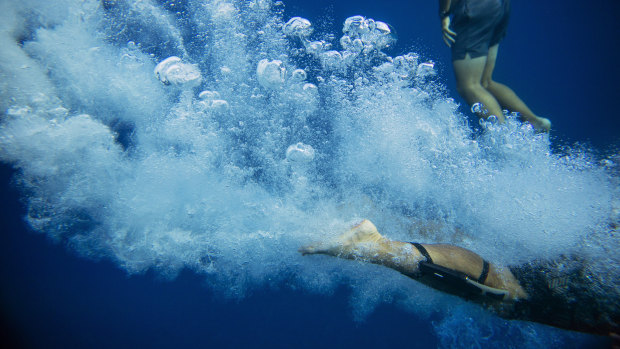 Walter Denton dives into the ocean in Agat: "Being out there, on the water, it's comforting. I just look around. It takes me to a different place."