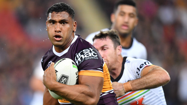 Tevita Pangai jnr (left) in action during the Round 22 match between the Broncos and Panthers at Suncorp Stadium on Friday.