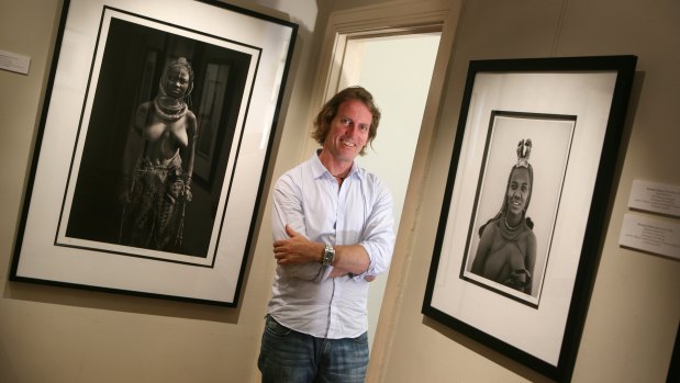 Photographer Christopher Rimmer, who often represents African themes, with some of his art works.