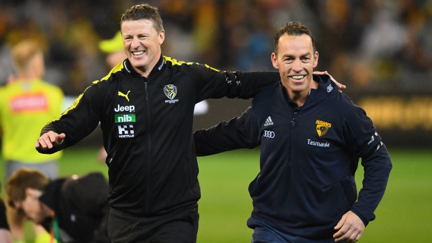 Damien Hardwick and Alastair Clarkson arm-in-arm before the 2018 qualifying final between the Tigers and the Hawks.