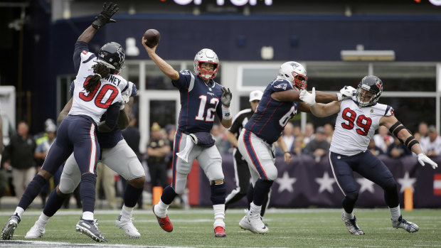 New England Patriots quarterback Tom Brady throws under pressure against the Texans.