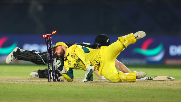 Australian wicketkeeper Josh Inglis runs out Jimmy Neesham after a late cameo for New Zealand.