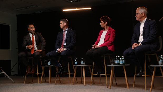 McGrathNicol senior risk adviser John Garnaut (far left) speaks at a panel with his former boss Malcolm Turnbull (right).