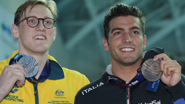 Australia's Mack Horton, left, holds his silver medal with bronze medallist Italy's Gabriele Detti after refusing to stand on the podium with the gold medal winner China's Sun Yang