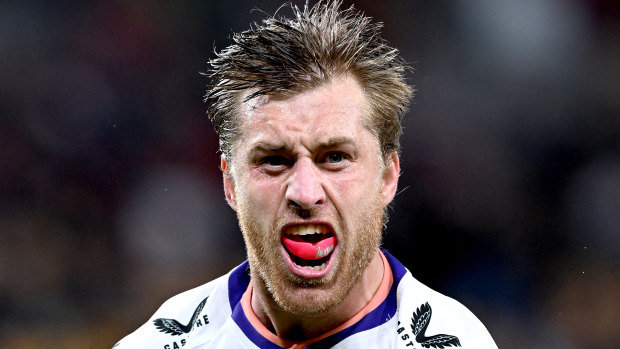 Cameron Munster of the Storm celebrates after scoring a try during the round 12 NRL match between Dolphins and Melbourne Storm at Suncorp Stadium.