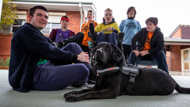 Carenne School's winning team, from left: William Tatnell, 17, Connor Drewe, 16, Kade Muldoon, 12, school captain Mitchell Allan, 18, Callan Derwnt, 13, and Keith Pracy, 15, and therapy dog Ollie. 