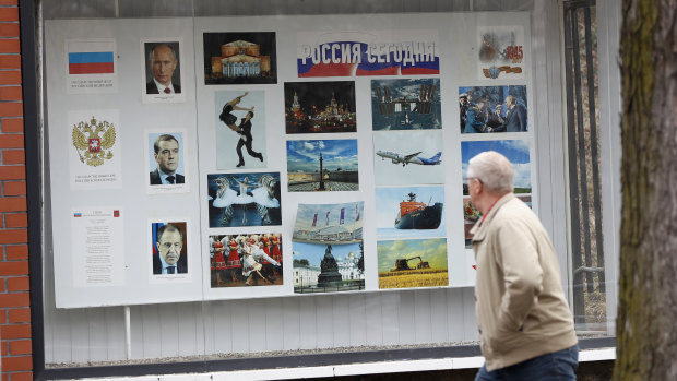 A man walks past the Russian embassy in Prague, Czech Republic. The country is expelling three staffers from the embassy.