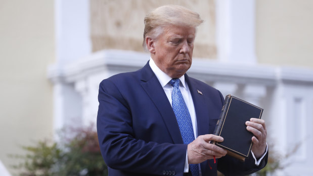 Donald Trump poses with a bible outside St. John's Episcopal Church in Washington.