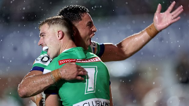 Ethan Sanders celebrates his first NRL try with Joe Tapine.
