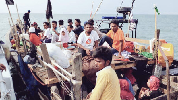 Malaysian navy officers detaining a boat carrying Rohingya migrants earlier this month.