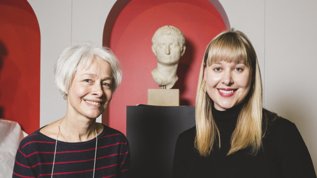 Head registrar Sara Kelly, and curator Dr Lily Withycomb, both of the National Museum of Australia, with the head of Augustus Caesar.