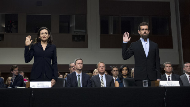 Facebook COO Sheryl Sandberg, left, accompanied by Twitter CEO Jack Dorsey at a Senate hearing
