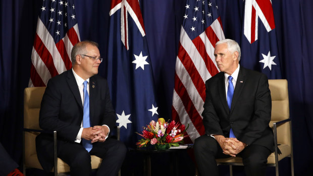 Prime Minister Scott Morrison speaks with US Vice-President Mike Pence at the APEC summit. 