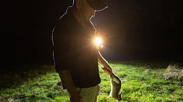 Russell Barnes with a freshly shot rabbit.