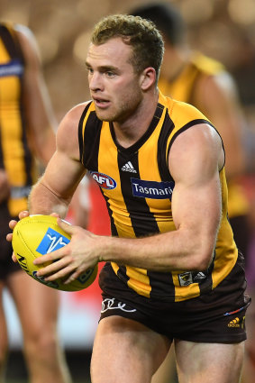 On the ball: Tom Mitchell in action against Adelaide.