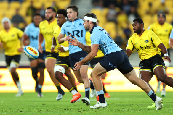 Lawson Creighton of the NSW Waratahs passes the ball.