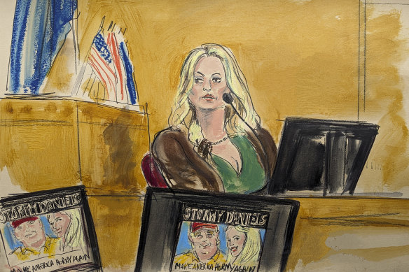 Stormy Daniels testifies as a promotional image for one of her shows is displayed on a monitor.