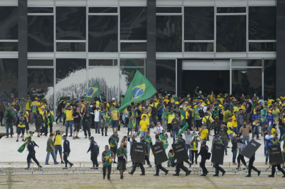 Supporters of Brazil’s former Brazilian president Jair Bolsonaro, storm the Supreme Court building in Brasilia, on January 8, in an attack bearing similarities to the riot at the US Capitol a year earlier.
