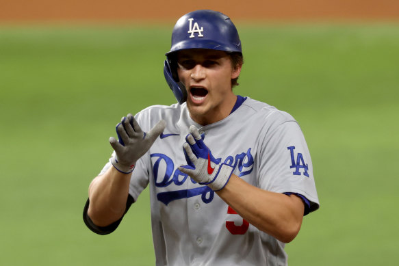 Corey Seager celebrates after batting in a run in game five.